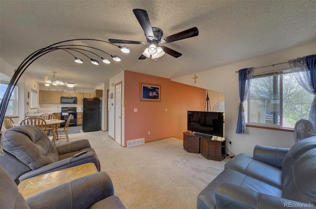 4987 Fabray Ln, Colorado Springs, CO 80922 - living room featuring a textured ceiling, light colored carpet, a ceiling fan, and baseboards