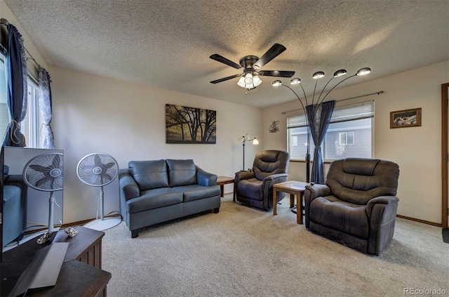 4987 Fabray Ln, Colorado Springs, CO 80922 - living area with ceiling fan, light carpet, a textured ceiling, and baseboards