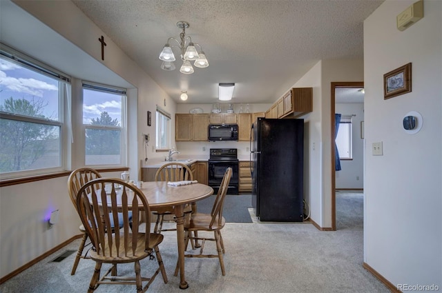 4987 Fabray Ln, Colorado Springs, CO 80922 - dining room featuring a chandelier, light carpet, baseboards, and a textured ceiling