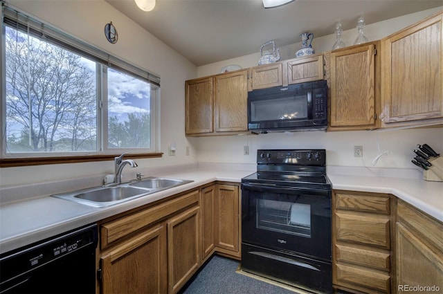 4987 Fabray Ln, Colorado Springs, CO 80922 - kitchen with black appliances, a sink, light countertops, and brown cabinets