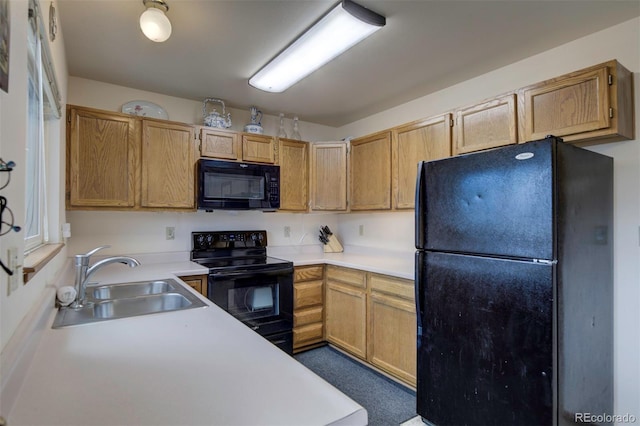 4987 Fabray Ln, Colorado Springs, CO 80922 - kitchen with black appliances, a sink, and light countertops