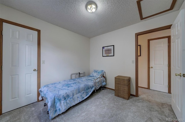 4987 Fabray Ln, Colorado Springs, CO 80922 - carpeted bedroom featuring a textured ceiling and baseboards