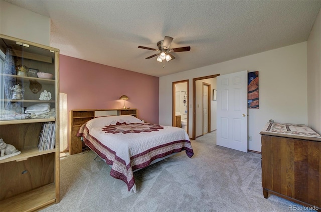 4987 Fabray Ln, Colorado Springs, CO 80922 - carpeted bedroom featuring a ceiling fan, a textured ceiling, and ensuite bath