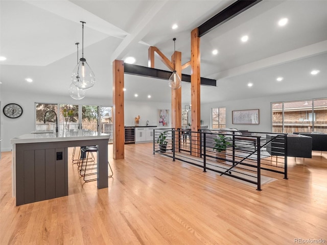 3049 S Vine St, Denver, CO 80210 - bar area featuring a sink, healthy amount of natural light, light wood-type flooring, recessed lighting, and decorative light fixtures