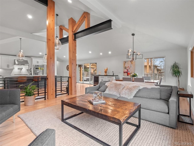 3049 S Vine St, Denver, CO 80210 - living room with healthy amount of natural light, recessed lighting, a chandelier, and light wood-style floors