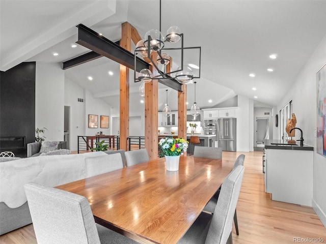 3049 S Vine St, Denver, CO 80210 - dining space with recessed lighting, a chandelier, light wood finished floors, beamed ceiling, and high vaulted ceiling