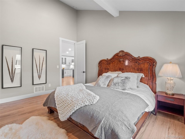 3049 S Vine St, Denver, CO 80210 - bedroom featuring beamed ceiling, light wood-style flooring, high vaulted ceiling, and baseboards