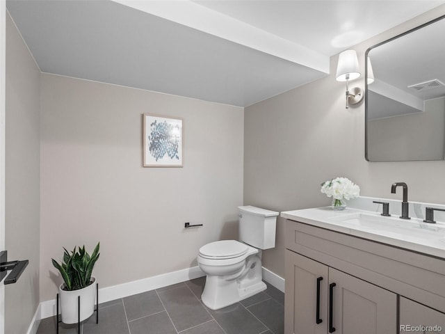 3049 S Vine St, Denver, CO 80210 - bathroom with baseboards, toilet, vanity, and tile patterned flooring