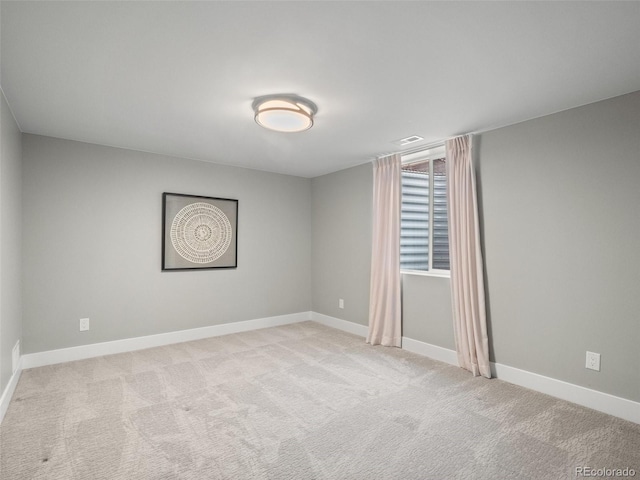 3049 S Vine St, Denver, CO 80210 - carpeted empty room with baseboards
