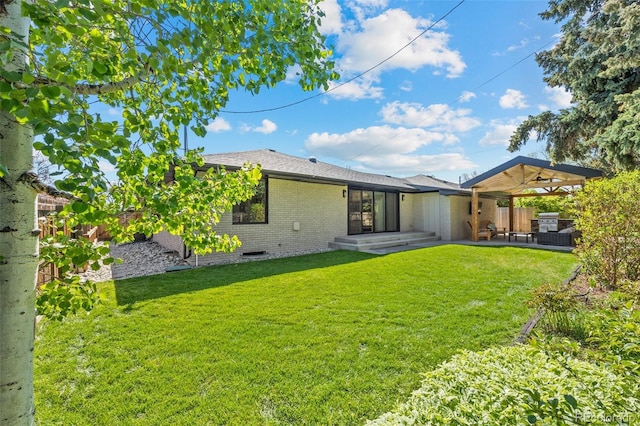 3049 S Vine St, Denver, CO 80210 - back of house featuring a patio area and brick siding