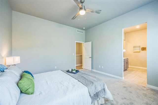 12574 Lake View St, Longmont, CO 80504 - bedroom with light carpet, baseboards, ensuite bathroom, and ceiling fan