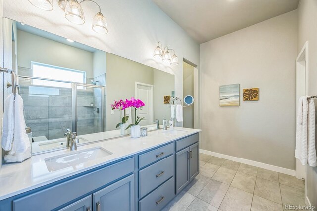 12574 Lake View St, Longmont, CO 80504 - full bath featuring double vanity, a stall shower, baseboards, and tile patterned flooring