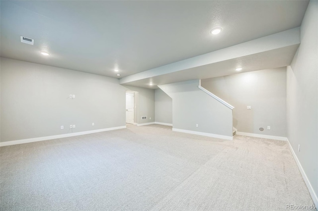 12574 Lake View St, Longmont, CO 80504 - finished basement featuring light carpet, stairway, recessed lighting, and baseboards