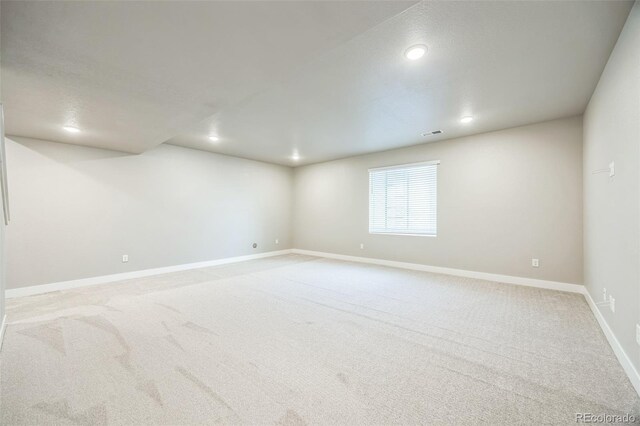 12574 Lake View St, Longmont, CO 80504 - unfurnished room with light colored carpet, baseboards, and recessed lighting