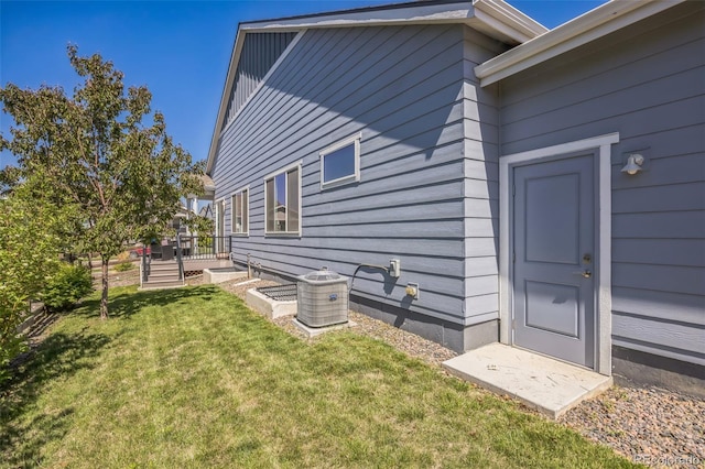 12574 Lake View St, Longmont, CO 80504 - entrance to property featuring a lawn and central air condition unit