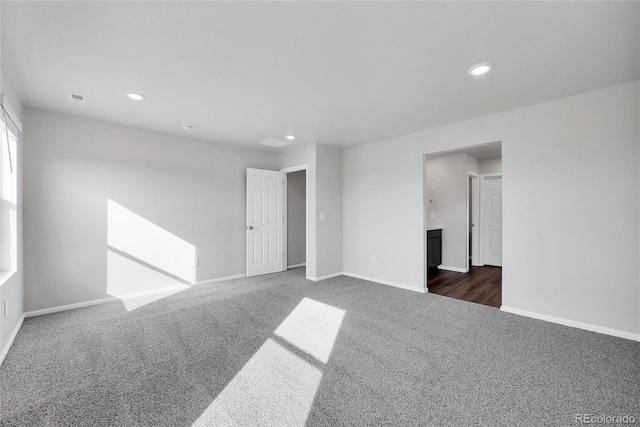 2705 73rd Avenue Ct, Greeley, CO 80634 - unfurnished room featuring dark carpet, baseboards, and recessed lighting