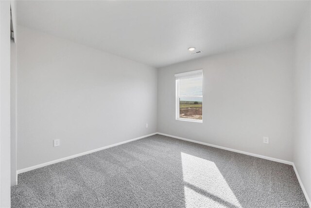 2705 73rd Avenue Ct, Greeley, CO 80634 - carpeted empty room featuring baseboards and recessed lighting