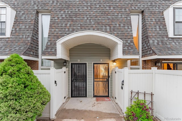 15491 E Wyoming Dr Unit A, Aurora, CO 80017 - entrance to property with a shingled roof and a gate