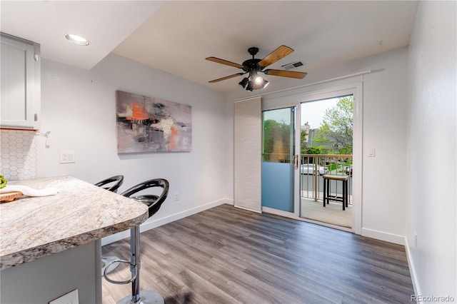 15491 E Wyoming Dr Unit A, Aurora, CO 80017 - home office with baseboards, wood finished floors, and a ceiling fan