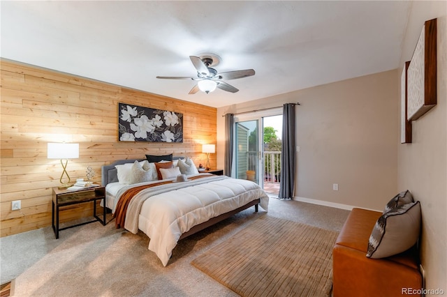 15491 E Wyoming Dr Unit A, Aurora, CO 80017 - bedroom with wood walls, access to outside, carpet floors, ceiling fan, and baseboards