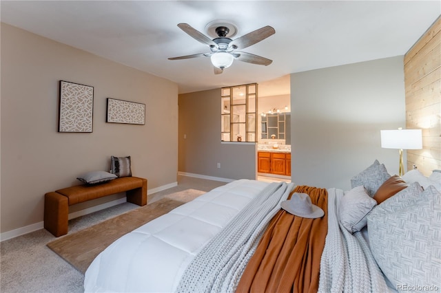 15491 E Wyoming Dr Unit A, Aurora, CO 80017 - bedroom with light carpet, baseboards, ensuite bathroom, and ceiling fan