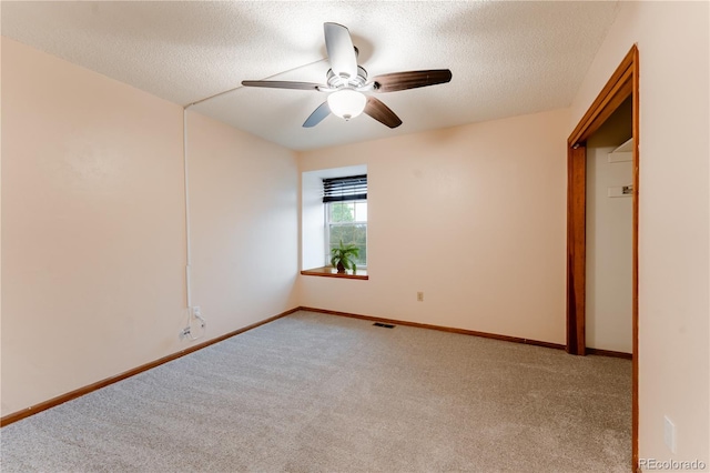 15491 E Wyoming Dr Unit A, Aurora, CO 80017 - unfurnished bedroom with carpet, a textured ceiling, baseboards, and ceiling fan