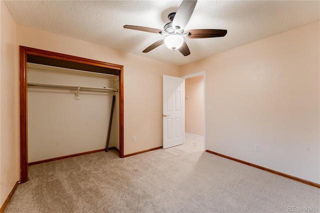 15491 E Wyoming Dr Unit A, Aurora, CO 80017 - unfurnished bedroom with a closet, carpet flooring, a textured ceiling, ceiling fan, and baseboards