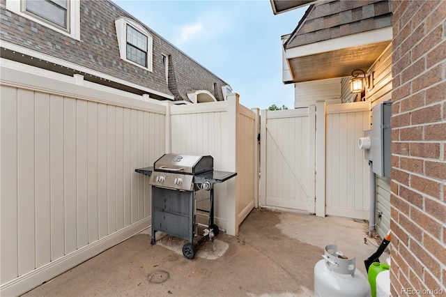15491 E Wyoming Dr Unit A, Aurora, CO 80017 - view of patio featuring a gate and a grill