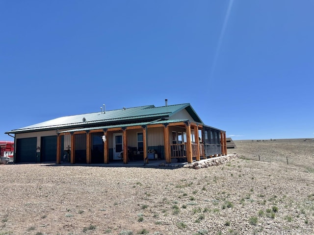 back of property with an outdoor structure