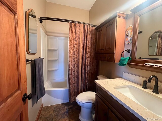 full bathroom featuring tile floors, toilet, oversized vanity, and shower / tub combo with curtain