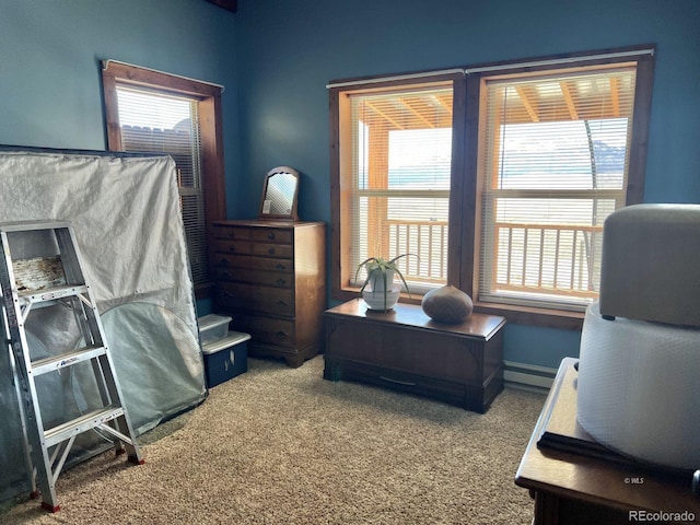 carpeted bedroom featuring a baseboard radiator