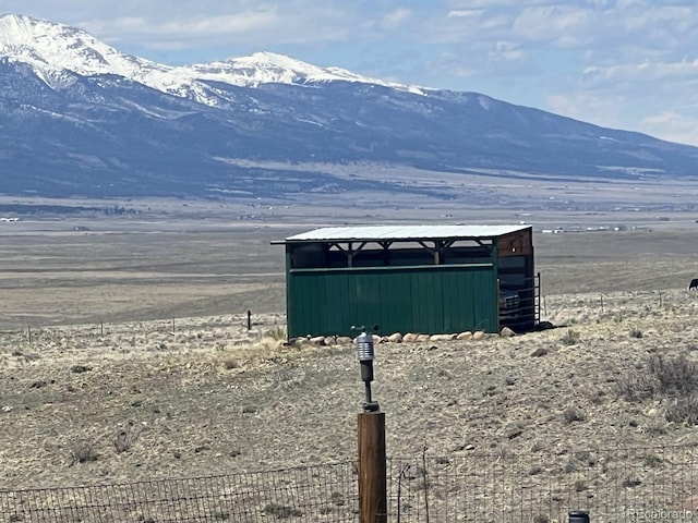 mountain view featuring a rural view