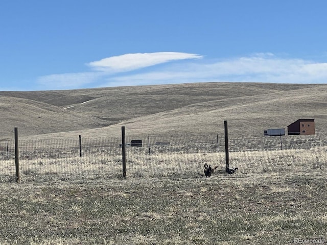 view of mountain feature with a rural view