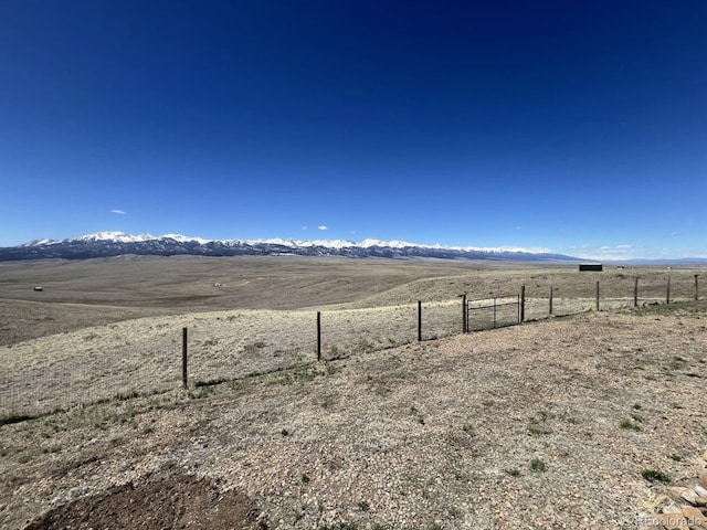 view of yard with a rural view