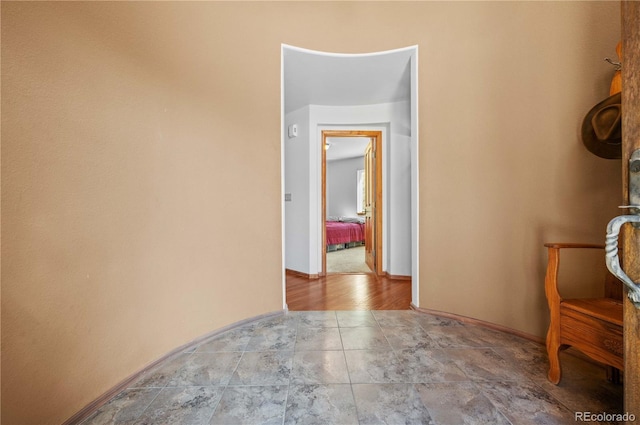 hallway with light hardwood / wood-style flooring