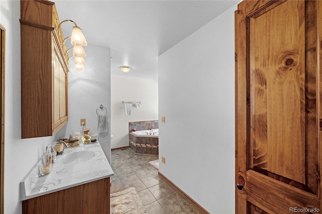 bathroom featuring vanity, tile patterned floors, and a bathtub