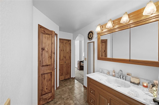 bathroom with vanity and tile patterned floors