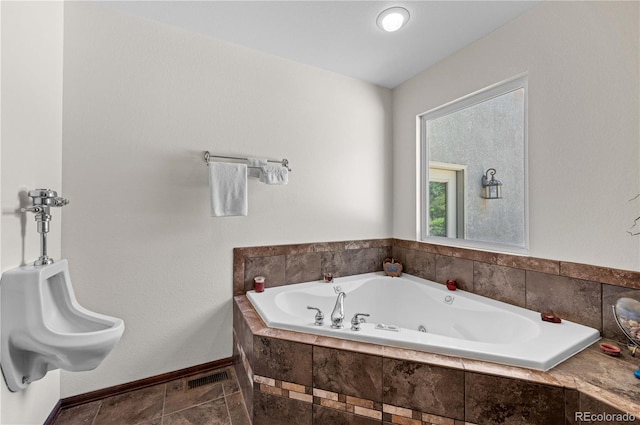 bathroom with tiled tub