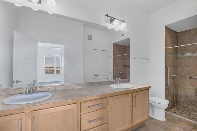 bathroom featuring an enclosed shower, tile patterned flooring, vanity, toilet, and ceiling fan