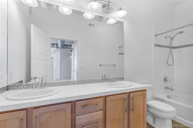 full bathroom featuring toilet, shower / bath combination, and vanity