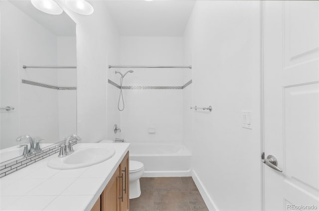 full bathroom featuring toilet, vanity, and tub / shower combination