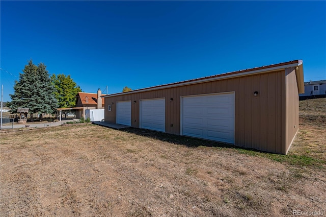 garage featuring wood walls