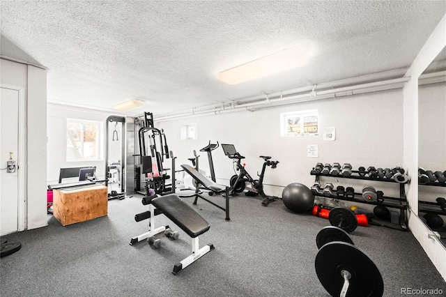 exercise area with a textured ceiling