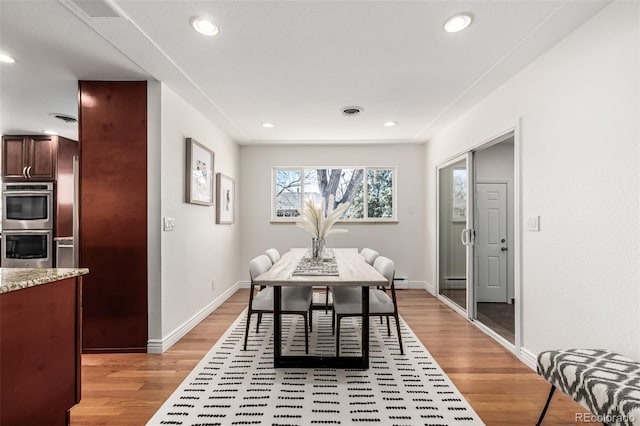 dining space featuring recessed lighting, visible vents, baseboards, and light wood-style floors