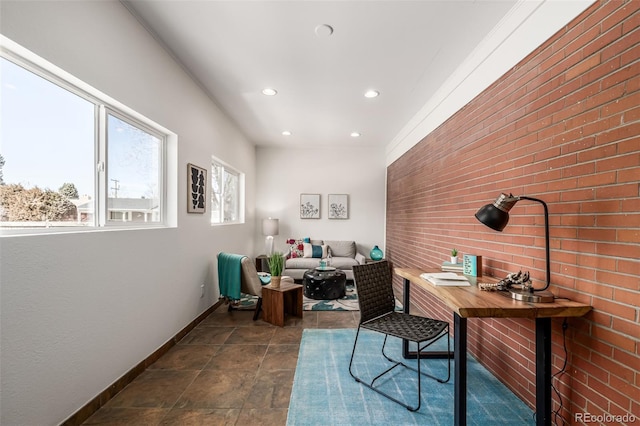 office featuring recessed lighting, baseboards, and brick wall