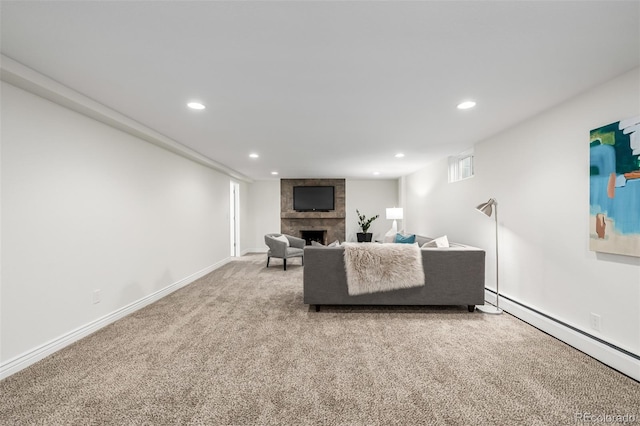 unfurnished living room featuring recessed lighting, baseboard heating, a stone fireplace, and carpet flooring