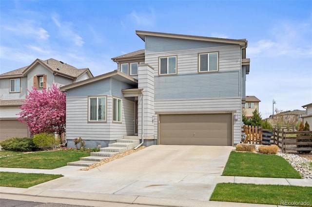 view of front of property featuring concrete driveway, fence, and a garage