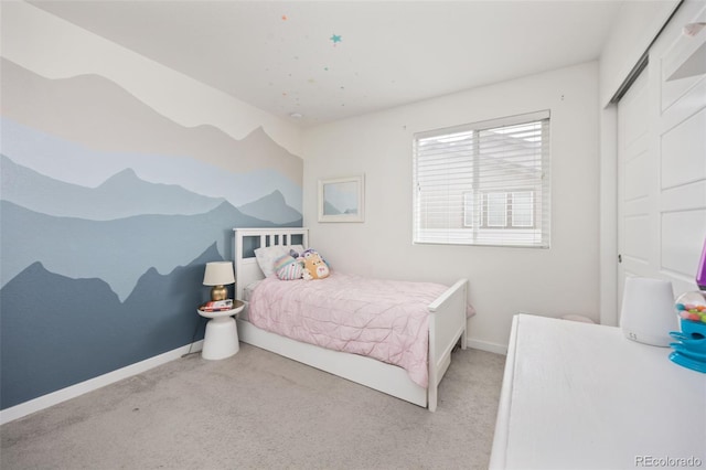 carpeted bedroom with baseboards