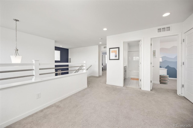 carpeted spare room with baseboards, recessed lighting, and visible vents