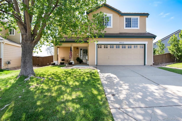 4963 Collingswood Dr, Highlands Ranch, CO 80130 - traditional home with stucco siding, driveway, and an attached garage